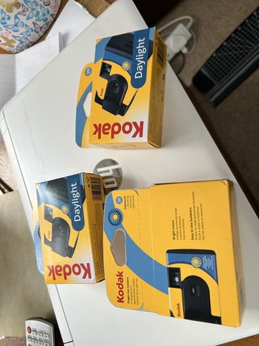 Three disposable cameras - three,